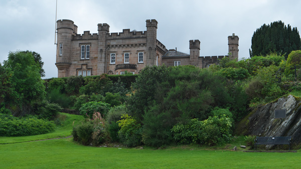 historic castle surrounded by lush greenery and trees three distinct architectural features